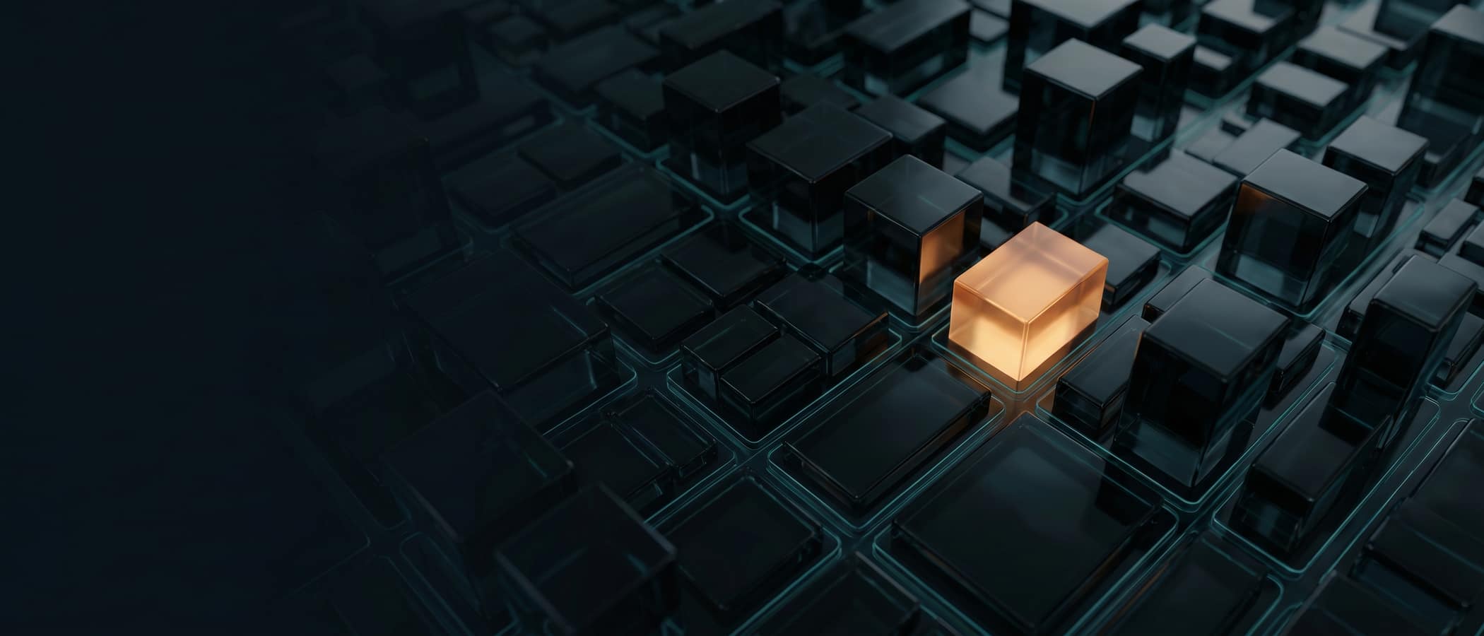 An aerial night city of dark glass blocks with one block glowing amber